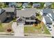 Charming two-story brick home featuring an attached garage and beautifully landscaped front yard at 55 Sudderth St, Buford, GA 30518