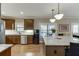 Well-equipped kitchen featuring granite counters, modern appliances, and convenient island at 55 Sudderth St, Buford, GA 30518