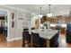 Bright kitchen featuring granite counters, pendant lighting, and stainless steel appliances at 55 Sudderth St, Buford, GA 30518