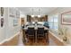 Spacious eat-in kitchen features a center island with seating and stainless steel appliances at 55 Sudderth St, Buford, GA 30518