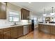 Updated kitchen with stainless steel appliances, granite countertops, and hardwood floors at 55 Sudderth St, Buford, GA 30518