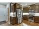 Stylish kitchen with granite countertops, stainless steel appliances, and modern cabinetry at 55 Sudderth St, Buford, GA 30518