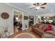 Open-concept living room showcases hardwood floors, comfortable seating, and natural light at 55 Sudderth St, Buford, GA 30518