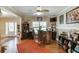 Open-concept living area featuring a bar, hardwood floors, and plenty of natural light at 55 Sudderth St, Buford, GA 30518