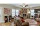 Comfortable living room with a brick fireplace, hardwood floors, and neutral decor at 55 Sudderth St, Buford, GA 30518