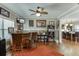 Open-concept living area featuring a bar, hardwood floors, and plenty of natural light at 55 Sudderth St, Buford, GA 30518