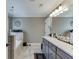 Main bathroom features dual sink vanity, shower and soaking tub at 55 Sudderth St, Buford, GA 30518