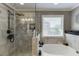 The main bathroom features a glass shower and soaking tub at 55 Sudderth St, Buford, GA 30518