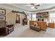 Spacious main bedroom with sitting area, ceiling fan and en suite access at 55 Sudderth St, Buford, GA 30518