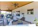 Relaxing screened in porch with ceiling fans, and comfortable outdoor seating, and grill at 55 Sudderth St, Buford, GA 30518