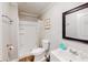Standard bathroom showing a toilet, shower stall and vanity with a sink and mirror at 8451 Magnolia Dr, Jonesboro, GA 30238