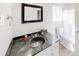 Green marble top bathroom features modern sink and neutral walls at 8451 Magnolia Dr, Jonesboro, GA 30238
