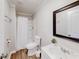 Bright bathroom features a shower, modern sink, and neutral walls at 8451 Magnolia Dr, Jonesboro, GA 30238