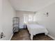 Bedroom boasts wood-look floors, bright natural light, and modern shelving at 8451 Magnolia Dr, Jonesboro, GA 30238