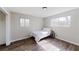 Bedroom features bright natural light and wood-look flooring at 8451 Magnolia Dr, Jonesboro, GA 30238