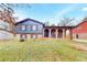 Charming brick home featuring a covered front porch with classic arched openings and well-maintained lawn at 8451 Magnolia Dr, Jonesboro, GA 30238