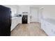 A well-lit kitchen features modern appliances, sleek countertops, and ample cabinet space at 8451 Magnolia Dr, Jonesboro, GA 30238