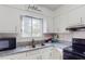 The kitchen features granite countertops, stainless steel appliances, and plenty of cabinet space at 8451 Magnolia Dr, Jonesboro, GA 30238