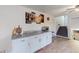 Open living space featuring stone counters, cabinets, and stairs at 8451 Magnolia Dr, Jonesboro, GA 30238