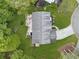 Aerial view of home with back deck and stairway to the backyard at 10090 Feather Sound Ct, Alpharetta, GA 30022