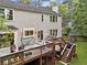 Lovely home back deck with outdoor seating and stairway to the backyard at 10090 Feather Sound Ct, Alpharetta, GA 30022