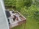 Aerial view of lovely back deck with outdoor seating with stairway to the backyard at 10090 Feather Sound Ct, Alpharetta, GA 30022