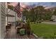 Cozy back deck with comfortable seating and lush landscaping, ideal for outdoor relaxation and entertaining at 10090 Feather Sound Ct, Alpharetta, GA 30022