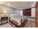 Basement bedroom with wood-look floors and colorful quilt at 10090 Feather Sound Ct, Alpharetta, GA 30022