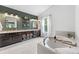 Beautiful bathroom features a soaking tub, double vanity, and updated fixtures at 10090 Feather Sound Ct, Alpharetta, GA 30022