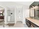 Large bath with stand up shower, bath tub, dual sinks and granite counters at 10090 Feather Sound Ct, Alpharetta, GA 30022