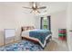 Childs bedroom with a ceiling fan, bright decor, and a large window at 10090 Feather Sound Ct, Alpharetta, GA 30022