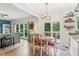 Bright dining area adjacent to kitchen with access to outdoor living space at 10090 Feather Sound Ct, Alpharetta, GA 30022