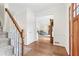 Bright foyer featuring hardwood floors and a staircase with white risers at 10090 Feather Sound Ct, Alpharetta, GA 30022