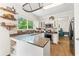 Well-equipped kitchen with open layout, granite countertops, and stainless steel appliances at 10090 Feather Sound Ct, Alpharetta, GA 30022