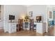 Dedicated home office space with custom desk and built-in storage at 10090 Feather Sound Ct, Alpharetta, GA 30022
