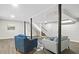 Finished basement space with two seating areas, and painted structural supports at 1140 Starline Se Dr, Smyrna, GA 30080