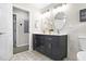 Bathroom with double sink vanity with floral patterned tile flooring at 1140 Starline Se Dr, Smyrna, GA 30080