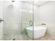 Bathroom features modern standalone tub and tiled walk in shower at 1140 Starline Se Dr, Smyrna, GA 30080