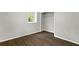 This bedroom boasts hardwood floors, natural light, and a closet for storage at 1140 Starline Se Dr, Smyrna, GA 30080