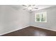 This bedroom features a window offering natural light, and hardwood floors at 1140 Starline Se Dr, Smyrna, GA 30080