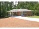 Charming brick home with a welcoming front porch, manicured lawn, and a stylish blue door at 1140 Starline Se Dr, Smyrna, GA 30080