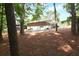 Spacious yard with trees and view of the home and back porch at 1140 Starline Se Dr, Smyrna, GA 30080