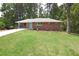 Charming brick home with well-manicured lawn and landscaping at 1140 Starline Se Dr, Smyrna, GA 30080