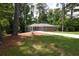 Charming single-story home with a well-maintained lawn and an inviting, long driveway at 1140 Starline Se Dr, Smyrna, GA 30080