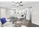 Bright living room with hardwood floors, with a view of the modern kitchen at 1140 Starline Se Dr, Smyrna, GA 30080