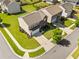Aerial view showcasing a well-maintained property with manicured landscaping and a spacious driveway at 1560 Avalon Creek Rd, Sugar Hill, GA 30518