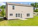 A well-maintained backyard with a lush green lawn and a cozy patio area for outdoor enjoyment at 1560 Avalon Creek Rd, Sugar Hill, GA 30518