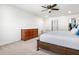Spacious bedroom features an area for sitting, as well as access to the bathroom at 1560 Avalon Creek Rd, Sugar Hill, GA 30518