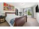 Bedroom featuring a large bed, comic book art, desk, and shelves at 1560 Avalon Creek Rd, Sugar Hill, GA 30518