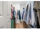 Walk in closet with clothing hanging at 1560 Avalon Creek Rd, Sugar Hill, GA 30518